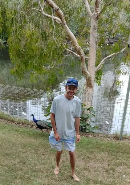 Bevan taking part in a supported community outing in a local park environment