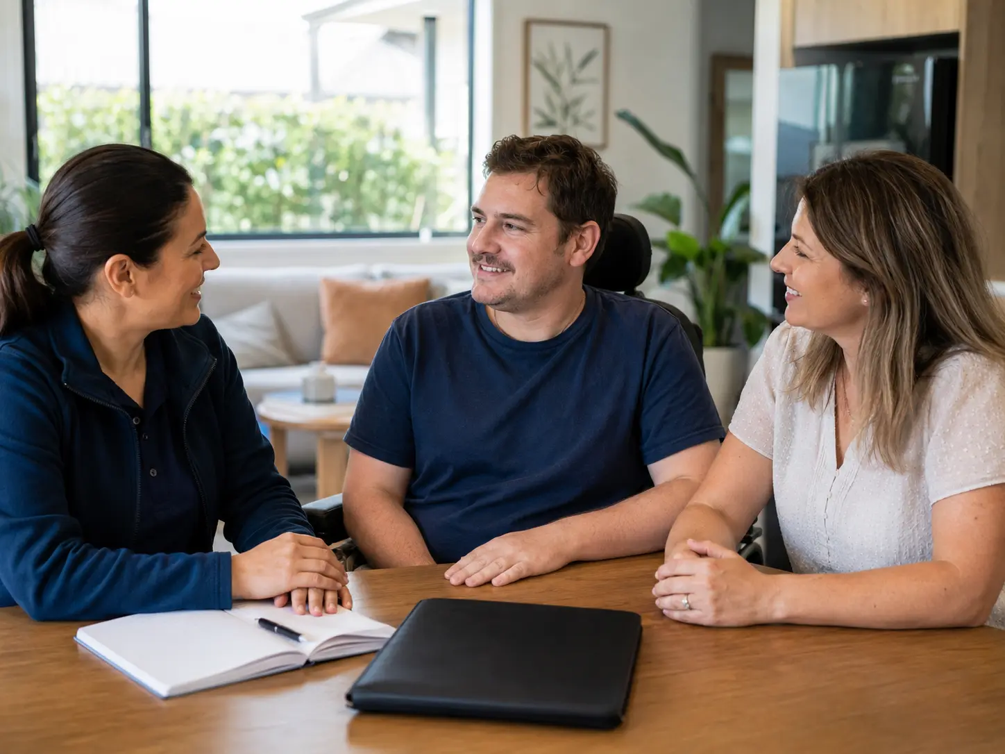 TAC support worker discussing plan-aligned personal care with a client and family member in Melbourne TAC case manager family and allied health communication for Melbourne support services